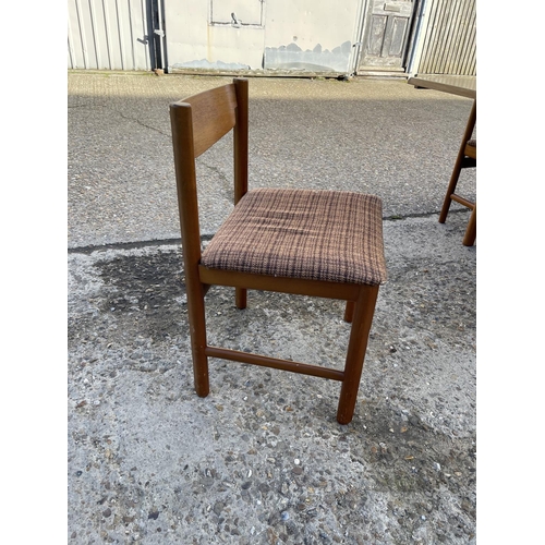 2 - An extending rectangular teak table and six teak chairs by White and Newton