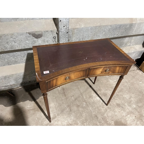 223 - A reproduction mahogany two drawer writing table