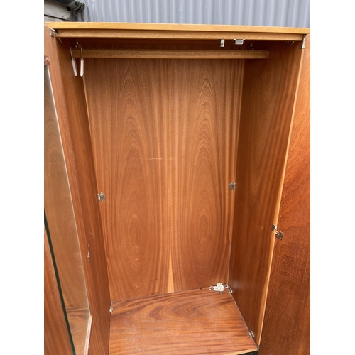 226 - A mid century light oak double wardrobe by stag