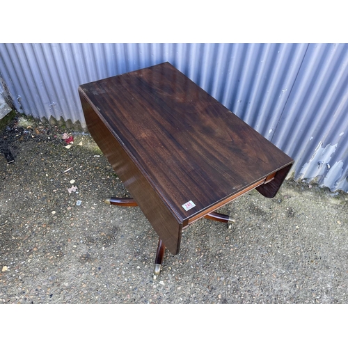 246 - A Victorian mahogany single pedestal drop leaf supper table