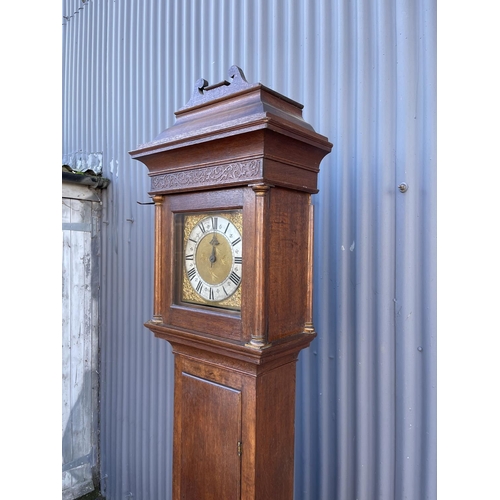 252 - An oak cased long case clock by JOHN COLLINS