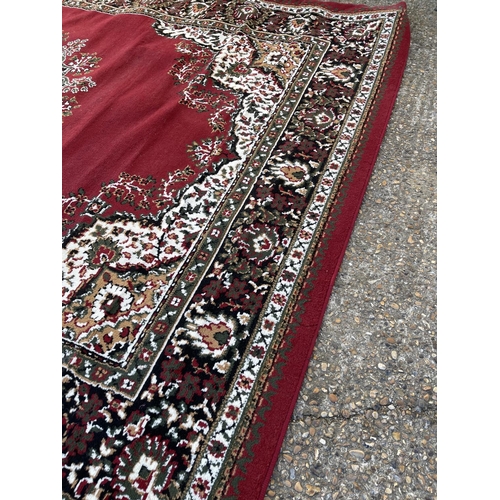 253 - A large red Axminster pattern carpet 300x240