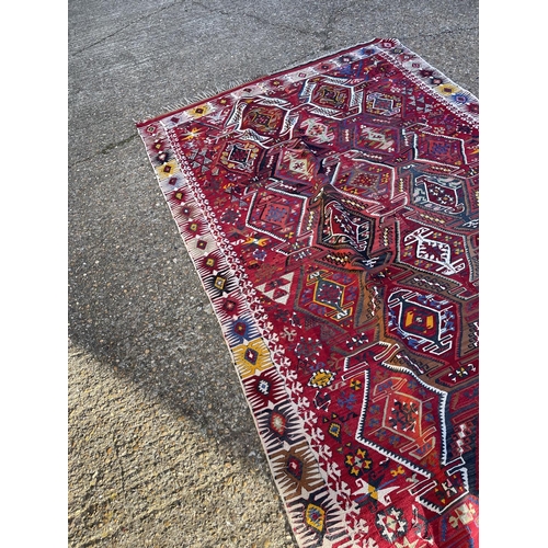 254 - A worn Aztec pattern rug 200x380