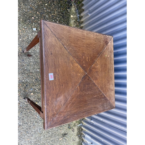 260 - An Edwardian oak envelope card table