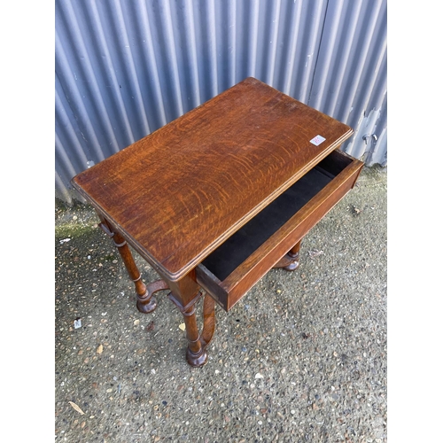 261 - An oak single drawer hall table