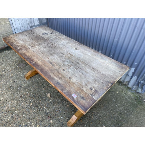 266 - A solid pine refectory style dining table with scaffold plank top  172x70