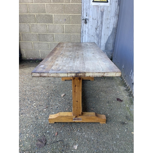 266 - A solid pine refectory style dining table with scaffold plank top  172x70