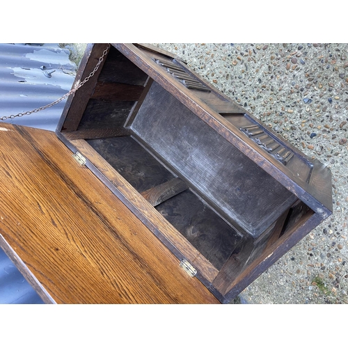 27 - A small oak blanket box with linenfold front