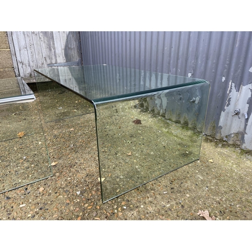 274 - A large and small pair of modern glass coffee tables larger 110x60x45