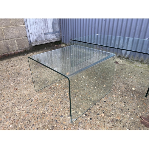 274 - A large and small pair of modern glass coffee tables larger 110x60x45