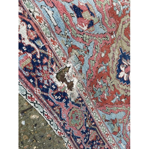 276 - An antique oriental red and blue Turkish pattern rug 150x170