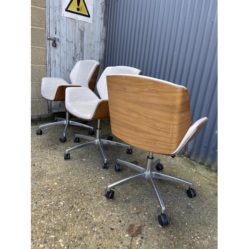 281 - Three EAMES STYLE cream upholstered swivel office chairs BY BOSS