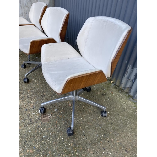 283 - Three EAMES STYLE cream upholstered swivel office chairs BY BOSS