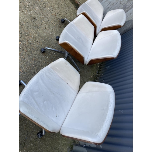 283 - Three EAMES STYLE cream upholstered swivel office chairs BY BOSS