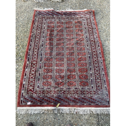 288 - A red oriental pattern rug 130x190