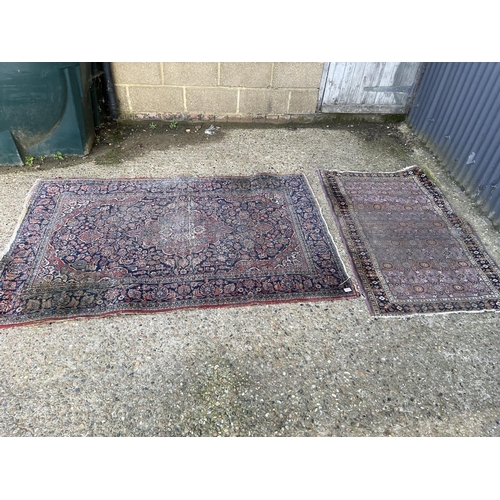 289 - Two red and blue oriental pattern rugs Larger 200x120