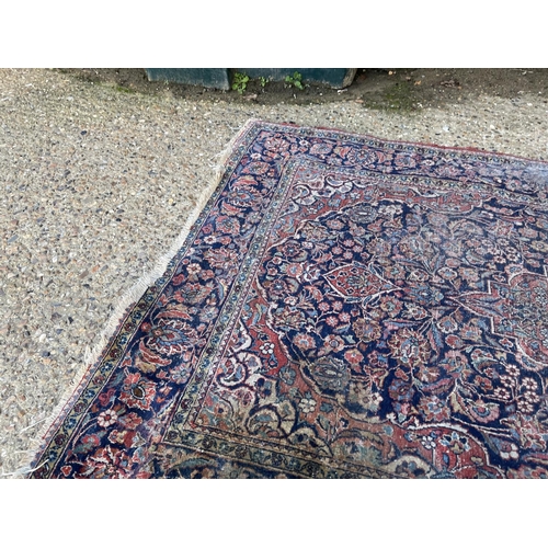 289 - Two red and blue oriental pattern rugs Larger 200x120