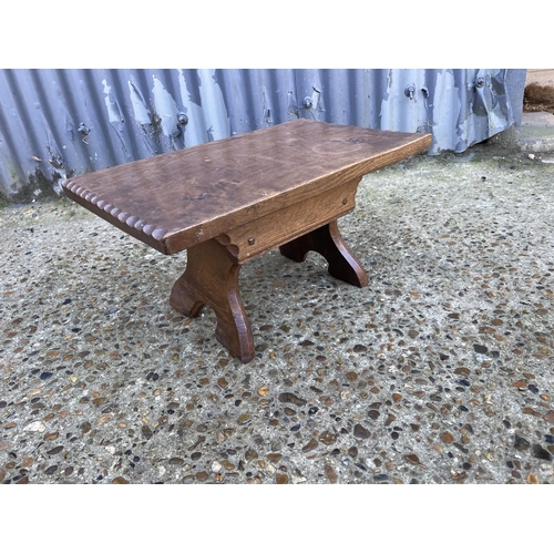 29 - A small carved stool / table by JACK GRIMBLE CROMER