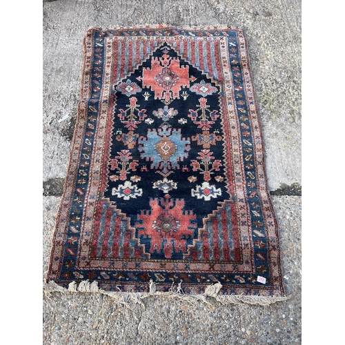 292 - An oriental pattern rug 180x115