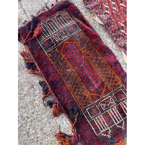 297 - Four small oriental rugs / mats