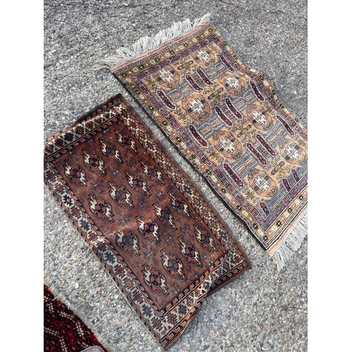 297 - Four small oriental rugs / mats