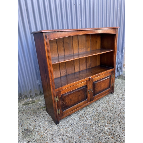 30 - A reproduction oak bookcase by TENTERDEN HOUSE INTERIORS 108cm wide