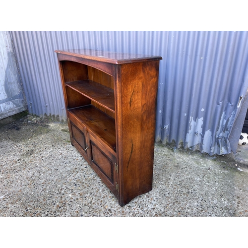 30 - A reproduction oak bookcase by TENTERDEN HOUSE INTERIORS 108cm wide