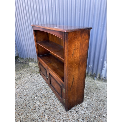 30 - A reproduction oak bookcase by TENTERDEN HOUSE INTERIORS 108cm wide