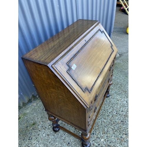 31 - A 1920's oak bureau with fitted interior