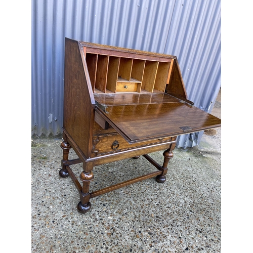 31 - A 1920's oak bureau with fitted interior