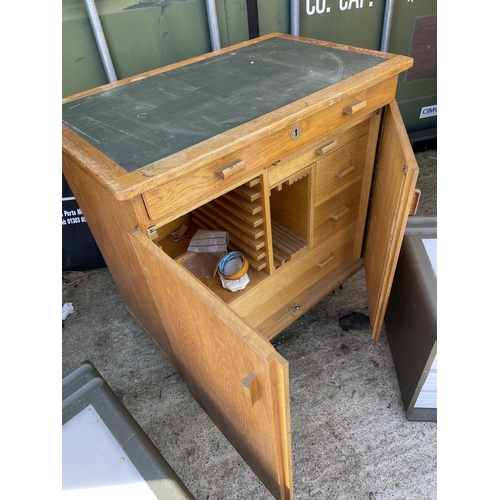 342 - An oak workshop cupboard and two green drawer units