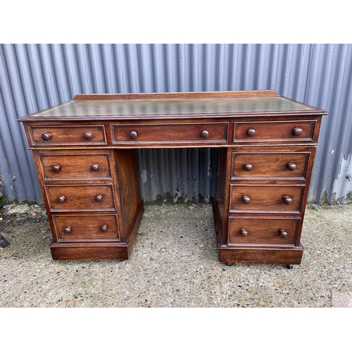 356 - A late  victorian twin pedestal mahogany desk with green leather top