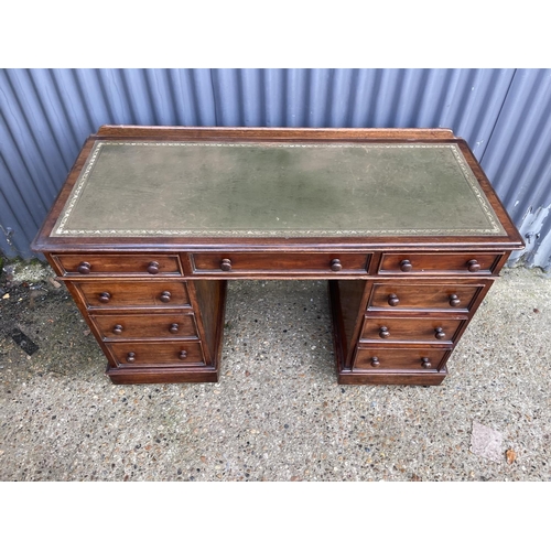 356 - A late  victorian twin pedestal mahogany desk with green leather top