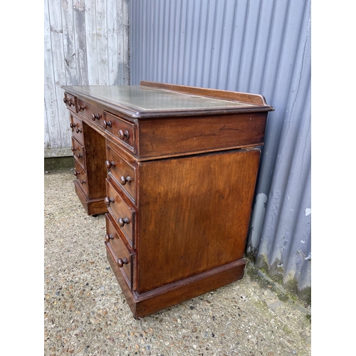 356 - A late  victorian twin pedestal mahogany desk with green leather top