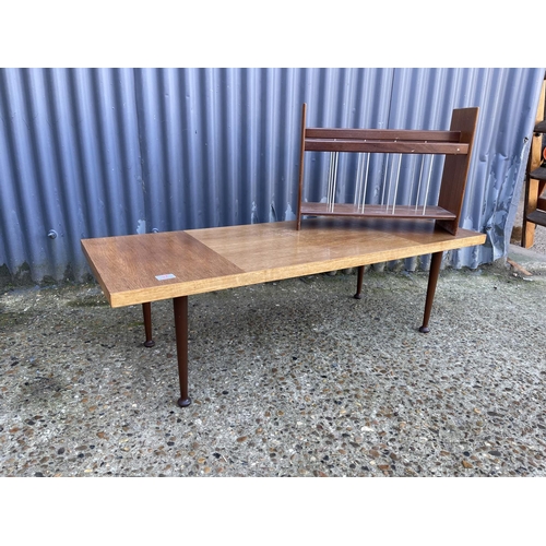 37 - A mid century teak coffee table  together with a teak magazine rack