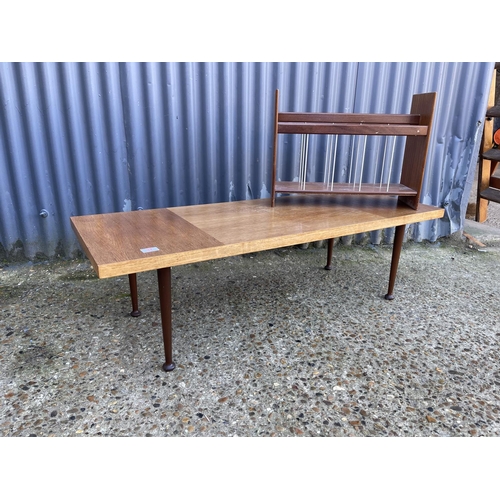 37 - A mid century teak coffee table  together with a teak magazine rack