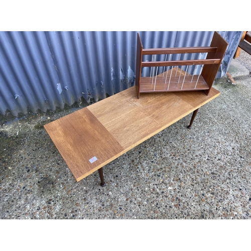 37 - A mid century teak coffee table  together with a teak magazine rack