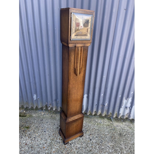 41 - A smiths electric oak cased grandmother clock