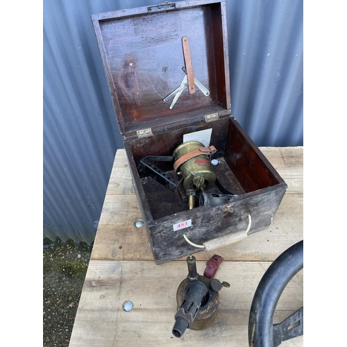 453 - Two brass blow torches, steering wheel, enamel shade and a vintage drill press