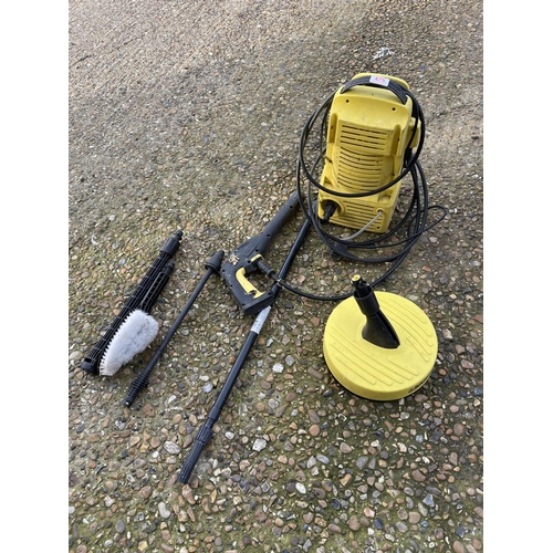 475 - A Karcher power washer with attachments