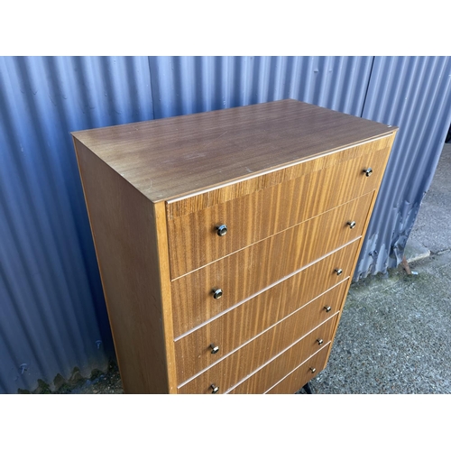 52 - A mid century teak tallboy chest of six drawers