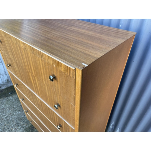 52 - A mid century teak tallboy chest of six drawers