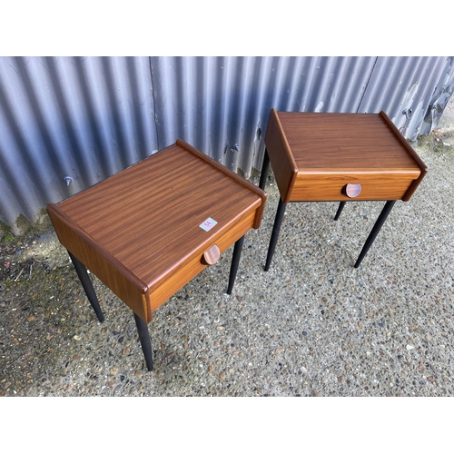 54 - A pair of mid century teak single drawer side tables raised on MAT black tapering legs