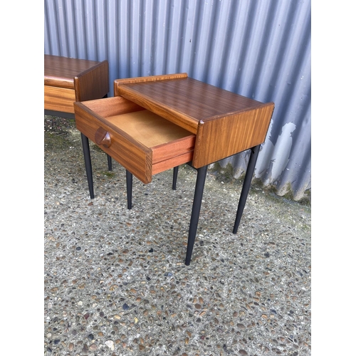 54 - A pair of mid century teak single drawer side tables raised on MAT black tapering legs