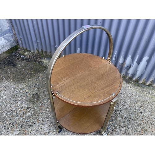 55 - A mid century brass and teak folding trolley cake stand