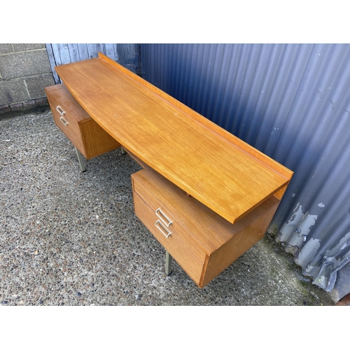 56 - A mid century stag four drawer kneehole desk