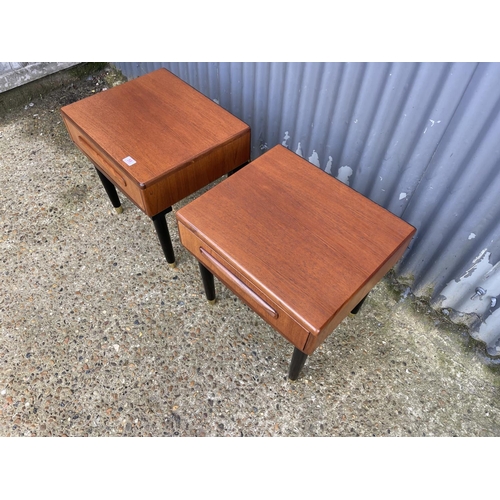 59 - A pair of g plan fresco teak single drawer side tables raised on tapering black legs