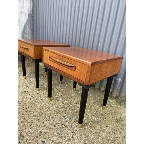 59 - A pair of g plan fresco teak single drawer side tables raised on tapering black legs