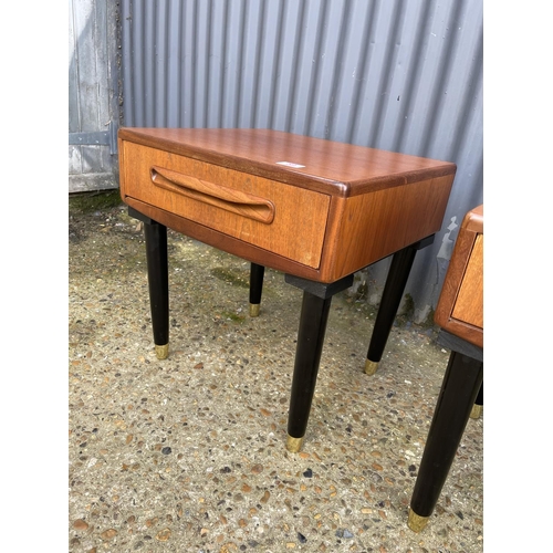 59 - A pair of g plan fresco teak single drawer side tables raised on tapering black legs