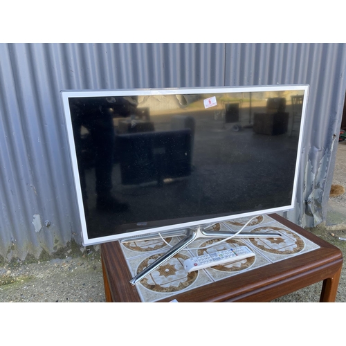 6 - A modern white flat screen tv